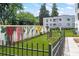 Fenced green space with a colorful mural, park benches, and building in the background at 88 Peachtree Memorial Nw Dr # 88, Atlanta, GA 30309