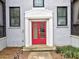 Eye-level view of a striking red door framed by white trim and flanked by matching windows at 88 Peachtree Memorial Nw Dr # 88, Atlanta, GA 30309