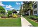 Community building exterior showcasing landscaping, sidewalks, and a pergola at 88 Peachtree Memorial Nw Dr # 88, Atlanta, GA 30309