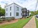 A three-story apartment building with screened-in patios and manicured landscaping at 88 Peachtree Memorial Nw Dr # 88, Atlanta, GA 30309