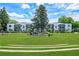 Full building shot with a large central gazebo on a wide lawn with ample trees at 88 Peachtree Memorial Nw Dr # 88, Atlanta, GA 30309