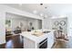 Open kitchen with stainless steel appliances, a large island, and a seamless connection to the living area at 88 Peachtree Memorial Nw Dr # 88, Atlanta, GA 30309