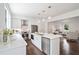 Bright, open kitchen with stainless steel appliances and an island, connecting to the living area at 88 Peachtree Memorial Nw Dr # 88, Atlanta, GA 30309