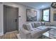 Comfortable living room with plush sofa, modern artwork, and bright window views at 88 Peachtree Memorial Nw Dr # 88, Atlanta, GA 30309