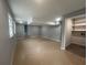 Partially finished basement featuring neutral paint, tile floors, and storage at 920 James Nw Ct, Marietta, GA 30060