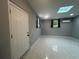 Bright basement features skylights, tile floors, and neutral gray paint at 920 James Nw Ct, Marietta, GA 30060