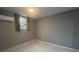Simple bedroom with neutral walls, tile floor, a single window, and a mini-split system at 920 James Nw Ct, Marietta, GA 30060