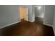 Bedroom with dark hardwood floors, neutral gray walls, closet with mirrored doors at 920 James Nw Ct, Marietta, GA 30060