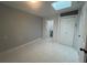 Bedroom featuring tile floors, a skylight, closet, and an en suite bathroom at 920 James Nw Ct, Marietta, GA 30060