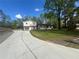 Two-story home with concrete driveway and large front yard at 920 James Nw Ct, Marietta, GA 30060