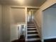 Entry hallway featuring dark hardwood floors and painted white stairs at 920 James Nw Ct, Marietta, GA 30060