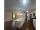 Bright kitchen with island, stainless appliances, and wood floors at 920 James Nw Ct, Marietta, GA 30060