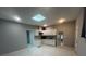 Basement kitchen area with white cabinets, tile floors, and a skylight at 920 James Nw Ct, Marietta, GA 30060