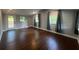 Spacious living room boasts hardwood floors and natural light from multiple windows at 920 James Nw Ct, Marietta, GA 30060
