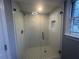 Modern bathroom shower with frameless glass door and white subway tile at 920 James Nw Ct, Marietta, GA 30060