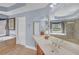 This bathroom features a glass-enclosed shower, soaking tub, and a large vanity at 1210 Spring Branch Ct, Lawrenceville, GA 30045