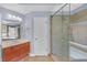 Bathroom features a luxurious glass-enclosed shower, stylish vanity, and updated fixtures at 1210 Spring Branch Ct, Lawrenceville, GA 30045