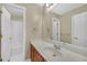 Bright bathroom featuring a soaking tub and shower combo with ample vanity space at 1210 Spring Branch Ct, Lawrenceville, GA 30045