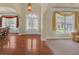 Bright foyer showcasing hardwood floors and arched doorways that lead to adjacent rooms at 1210 Spring Branch Ct, Lawrenceville, GA 30045