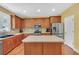 Spacious kitchen with stainless steel appliances, wooden cabinets, and an island for extra counter space at 1210 Spring Branch Ct, Lawrenceville, GA 30045