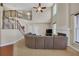 Bright living room boasts a soaring ceiling, fireplace, and staircase access to the second floor at 1210 Spring Branch Ct, Lawrenceville, GA 30045