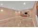 Open-concept living area with travertine floors, neutral walls and arched doorway at 1210 Spring Branch Ct, Lawrenceville, GA 30045