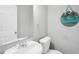 Clean bathroom featuring a classic sink, toilet, and decorative wall art at 1683 Briarcliff Rd # 6, Atlanta, GA 30306