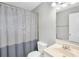 Simple bathroom with shower curtain, toilet, and vanity sink with mirror at 1683 Briarcliff Rd # 6, Atlanta, GA 30306