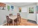 Bright dining room with wood table, colorful artwork, and hardwood floors at 1683 Briarcliff Rd # 6, Atlanta, GA 30306