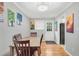 Bright dining room with wood table, colorful artwork, and hardwood floors at 1683 Briarcliff Rd # 6, Atlanta, GA 30306