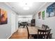 Inviting dining area with hardwood floors, modern light fixtures, and colorful artwork at 1683 Briarcliff Rd # 6, Atlanta, GA 30306