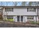 Exterior view of a multi-unit building with white brick and black shutters at 1683 Briarcliff Rd # 6, Atlanta, GA 30306