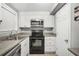 Functional kitchen with modern microwave, and black range at 1683 Briarcliff Rd # 6, Atlanta, GA 30306