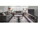 Comfortable living room with a couch, hardwood floors, a tv, and a glass table at 1683 Briarcliff Rd # 6, Atlanta, GA 30306