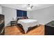Spacious main bedroom with hardwood floors, ceiling fan, and comfortable decor at 1683 Briarcliff Rd # 6, Atlanta, GA 30306