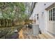 Outdoor patio with stone retaining wall, weathered fence, and seating area at 1683 Briarcliff Rd # 6, Atlanta, GA 30306
