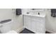 Bathroom with white vanity, large mirror, and chrome fixtures at 2675 Misty Morning Ln, Roswell, GA 30076