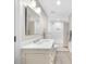Neutral colored bathroom featuring a shower/tub combo with a white subway tile surround, a spacious vanity, and wood-look flooring at 2675 Misty Morning Ln, Roswell, GA 30076