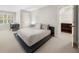 Bedroom with neutral color scheme, large windows, and walk-in closet at 2675 Misty Morning Ln, Roswell, GA 30076