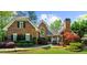 Charming brick home with manicured lawn and lush landscaping at 2675 Misty Morning Ln, Roswell, GA 30076