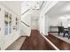 Bright foyer featuring a staircase, wood floors, and view into dining area at 2675 Misty Morning Ln, Roswell, GA 30076