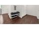 Hallway with decorative wood floors, built in storage and decorative console table at 2675 Misty Morning Ln, Roswell, GA 30076