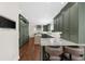 Kitchen featuring granite countertops, hardwood floors, and modern appliances at 2675 Misty Morning Ln, Roswell, GA 30076