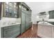 Spacious kitchen with hardwood floors, a large center island, and custom cabinets at 2675 Misty Morning Ln, Roswell, GA 30076
