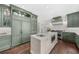 Modern kitchen features built-in refrigerator, stainless steel appliances, and a center island at 2675 Misty Morning Ln, Roswell, GA 30076