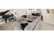 Spacious living room with a large sectional sofa, piano, and open layout at 2675 Misty Morning Ln, Roswell, GA 30076