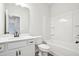 The bright bathroom features a combination tub and shower, white vanity, and sleek fixtures at 27 Kensington St, Kingston, GA 30145