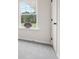 Bright room has a For Sale sign in the window and a white door at 27 Kensington St, Kingston, GA 30145