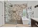 Modern bathroom with a walk-in shower, soaking tub, neutral gray tiling, and matte black fixtures at 45 Cherrystone Walk, Suwanee, GA 30024
