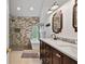 Remodeled bathroom with dual vanity, soaking tub, walk-in shower, and stylish fixtures at 45 Cherrystone Walk, Suwanee, GA 30024